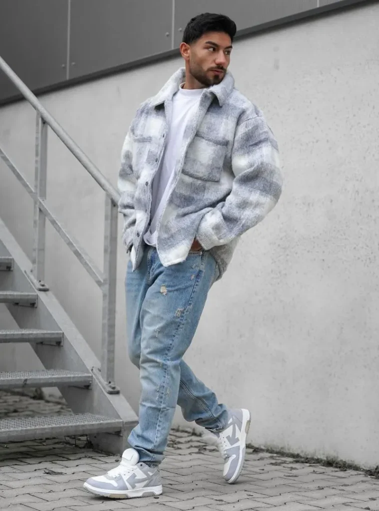 16 Fall Outfits With Jeans for Men You Can Actually Wear 2 a man wearing a Light-Wash Jeans with a Soft Grey Plaid Overshirt