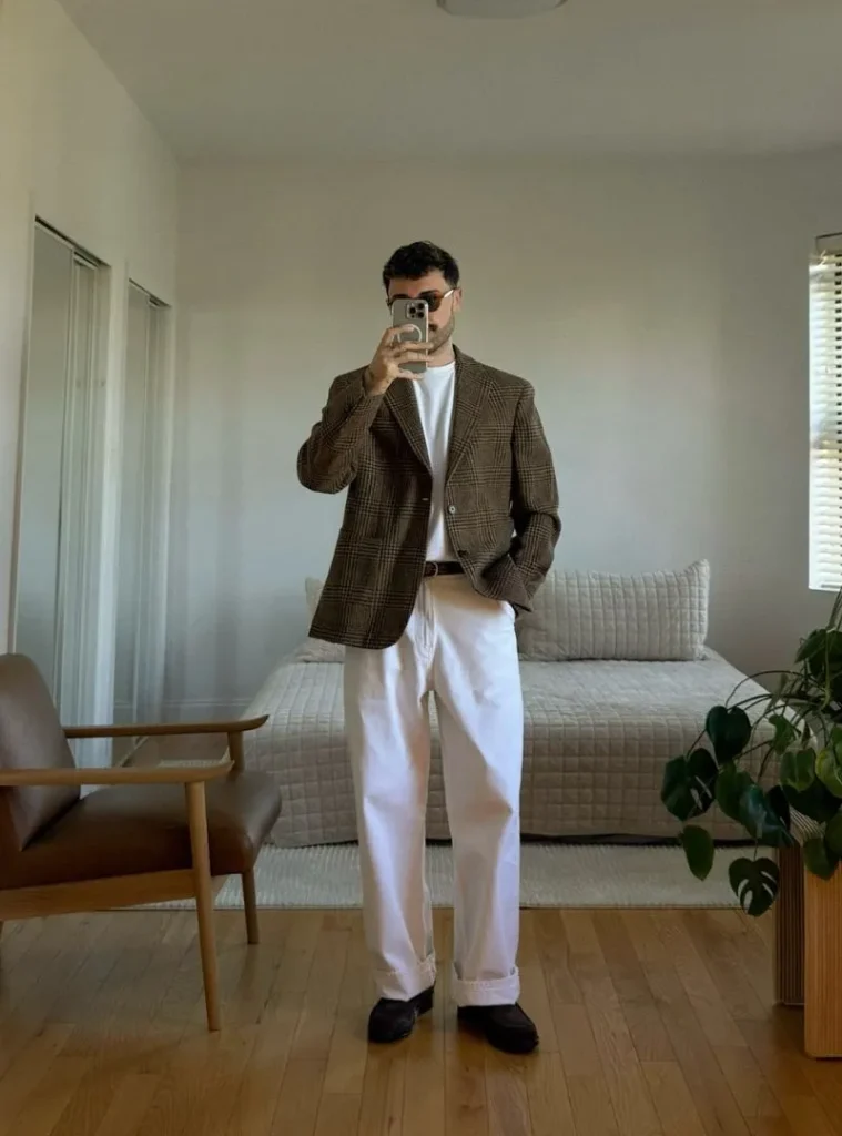 12 Smart Fall Business Casual Outfit Ideas to Look Sharp 4 a man posing in a Glen Plaid Wool Sport Coat with Knit Polo and Slacks