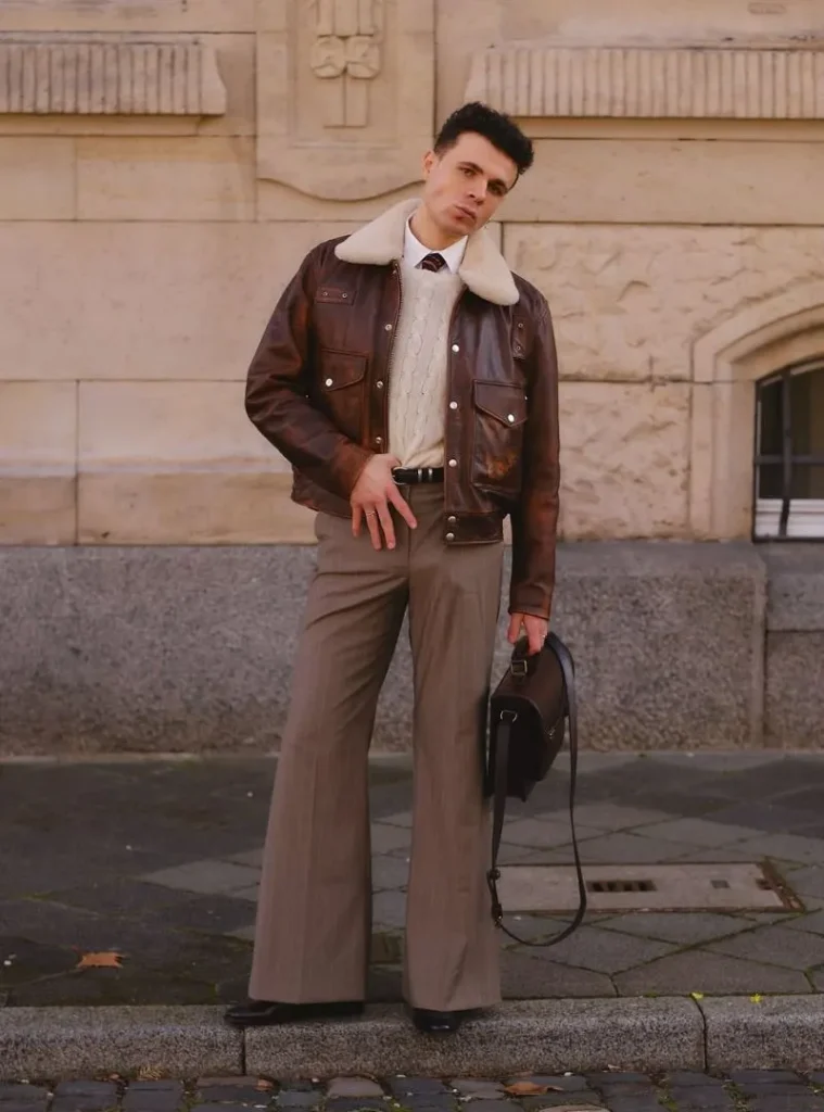 22 Fall Jackets Outfit Ideas for Men to Layer Up in Style 3 a man posing in a Shearling Aviator Leather Jacket with Flared Trousers