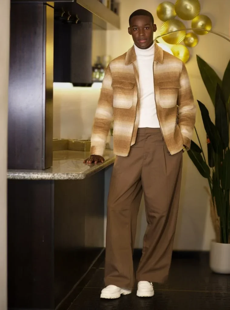17 Easy Men Fall Outfit Ideas That Keep You Warm 16 a man posing in a Ombré Wool Zip Jacket with Caramel Wide-Leg Slacks