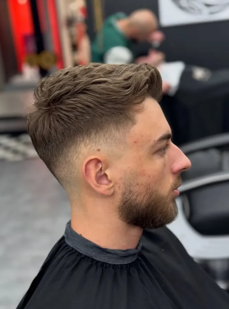 19 Skin Fade Hair Styles Men Can Try for a Clean, Modern Cut 6 Hair style of a man Soften a Voluminous Quiff With a mid Skin Fade