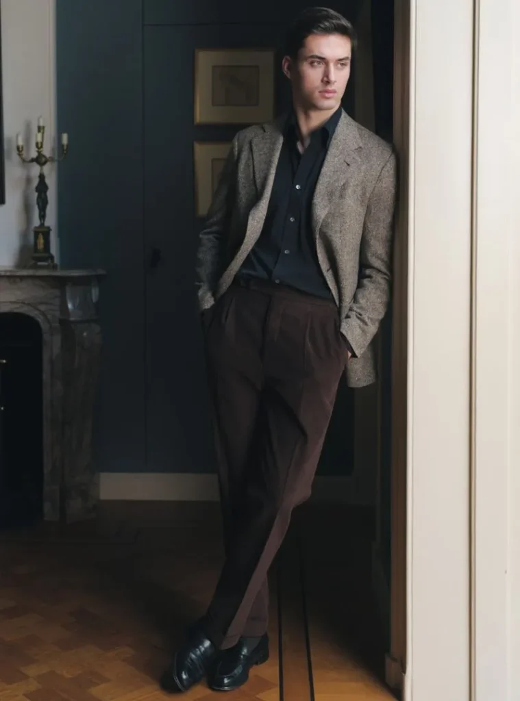 17 Winter Formal Outfits for Men That Look Sharp 5 a man posing in a Brown Tweed Blazer with Black Shirt and Chocolate Trousers