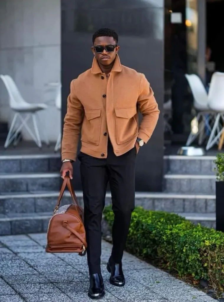 22 Fall Jackets Outfit Ideas for Men to Layer Up in Style 4 a man wearing a High-Collar Camel Wool Blouson with Slim Trousers