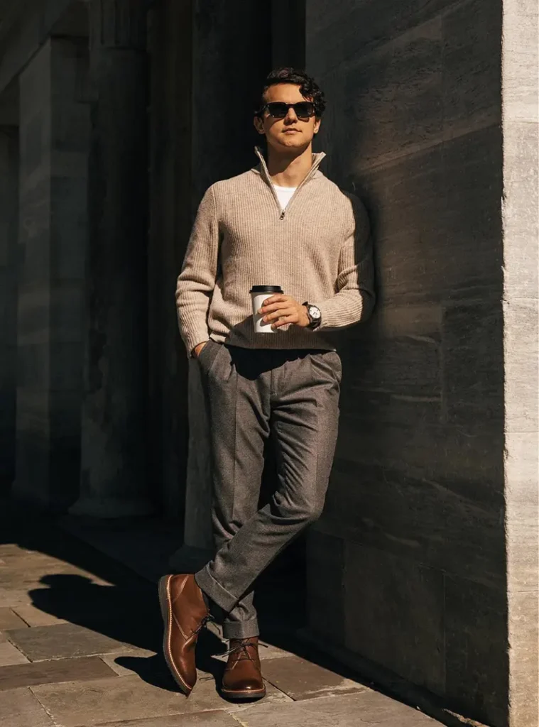 20 Easy Ideas for Fall Casual Outfits Men Can Rely On 21 a man posing in a Ribbed Quarter-Zip with Tailored Charcoal Trousers