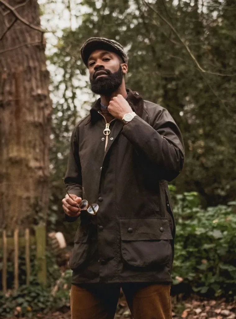 22 Fall Jackets Outfit Ideas for Men to Layer Up in Style 5 a man posing in a Waxed Cotton Hunting Jacket with Corduroy Trousers