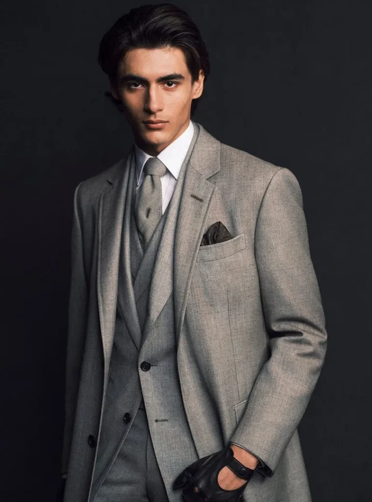 17 Winter Formal Outfits for Men That Look Sharp 8 a man in a Tonal Grey Three-Piece Suit with Matching Tie