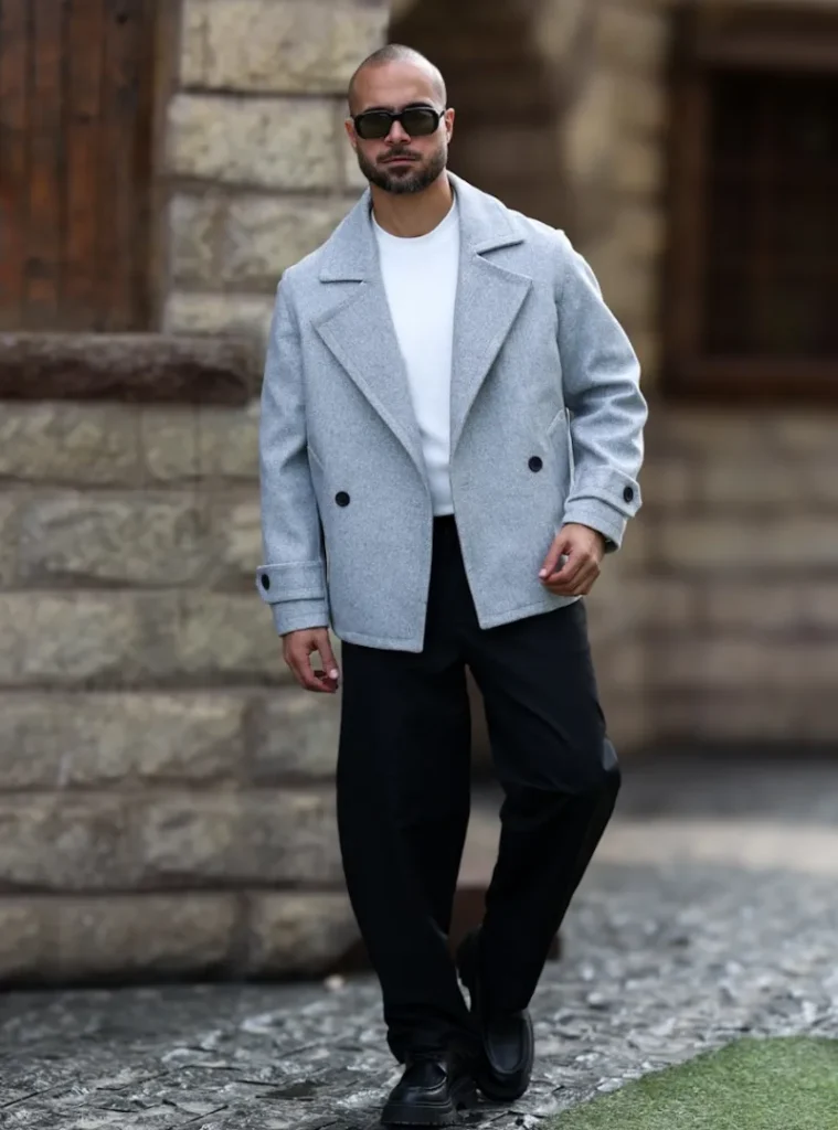 14 Men Casual Winter Outfits Ideas for Everyday Style 5 a guy with the Cropped Light Grey Peacoat Over a Clean White Tee