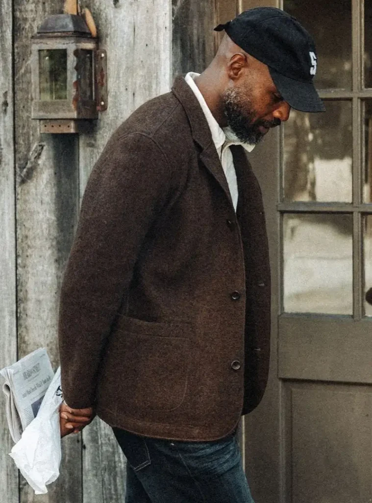 22 Fall Jackets Outfit Ideas for Men to Layer Up in Style 11 a man posing in a Textured Boiled Wool Blazer with Dark Denim