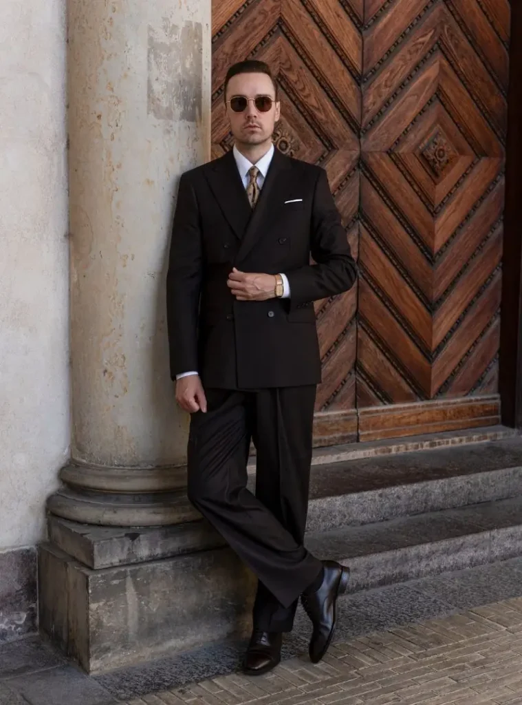 17 Winter Formal Outfits for Men That Look Sharp 10 a man in a Dark Double-Breasted Suit with a Patterned Tie