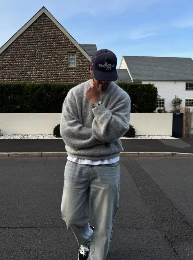 20 Easy Ideas for Fall Casual Outfits Men Can Rely On 16 a man posing in a Brushed Grey Wool with Light Wash Denim