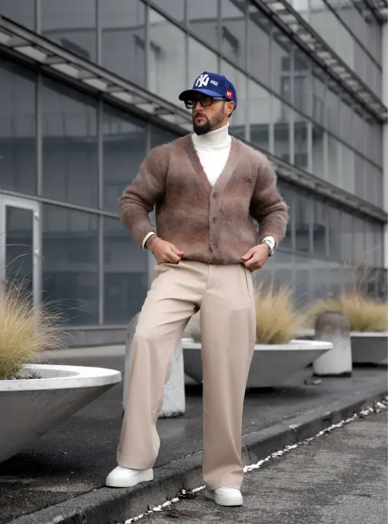 14 Men Casual Winter Outfits Ideas for Everyday Style 9 A man wearing Fuzzy Mohair Cardigan with a Fitted White Turtleneck