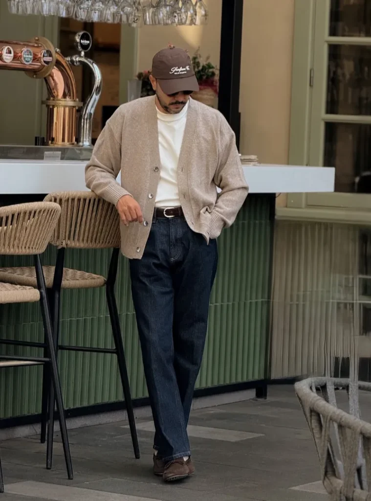 20 Easy Ideas for Fall Casual Outfits Men Can Rely On 13 a man posing in a Slouchy Beige Cardigan with Dark Raw Denim