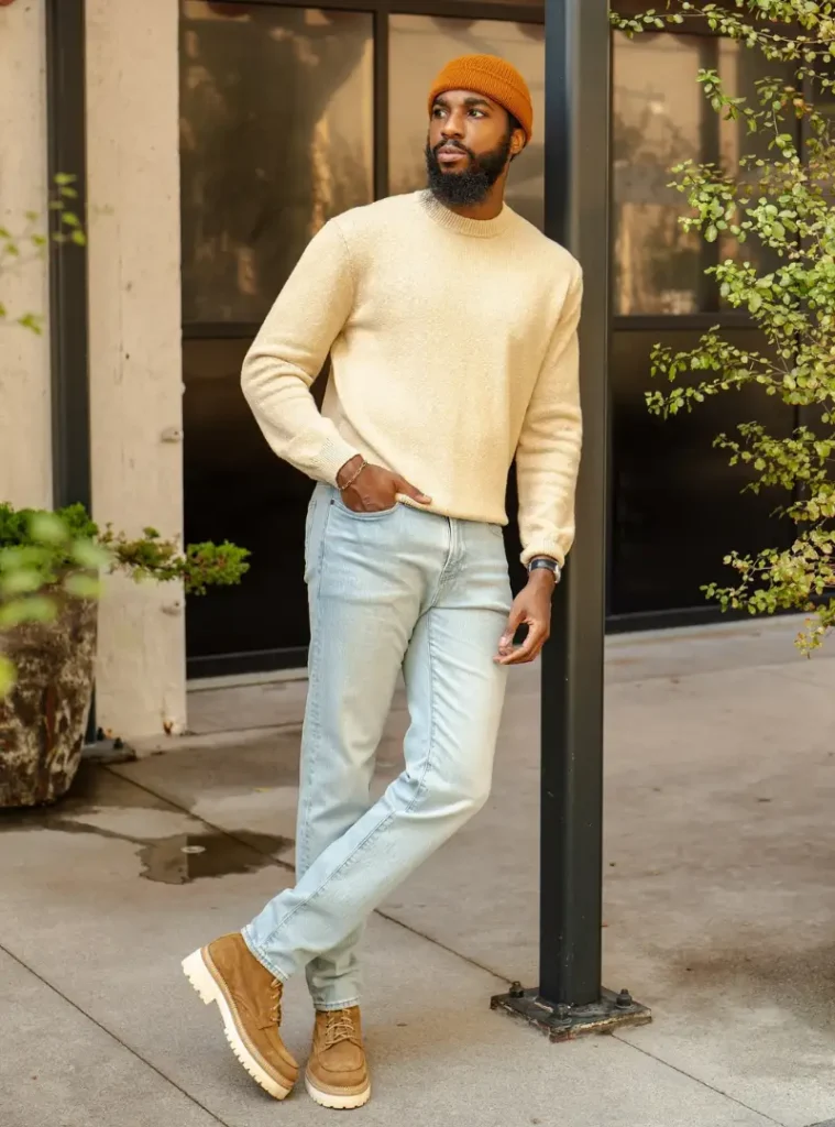 17 Easy Men Fall Outfit Ideas That Keep You Warm 13 a man posing in a Oatmeal Bouclé Crewneck with Amber Beanie and Suede Boots