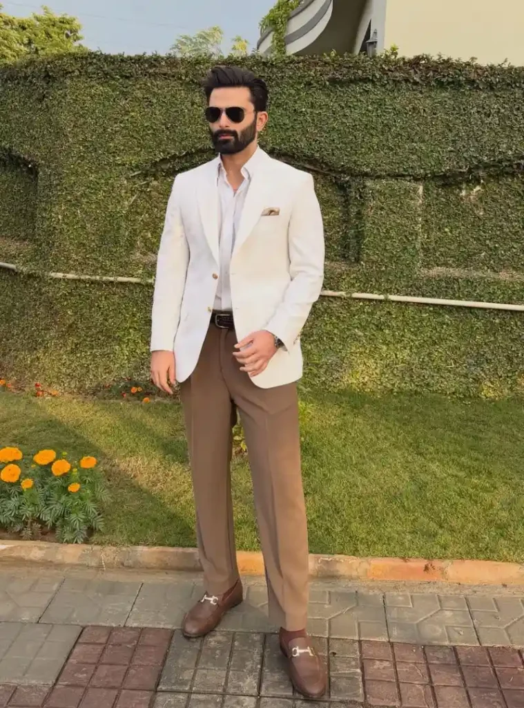 17 Winter Formal Outfits for Men That Look Sharp 15 a man wearing a Ivory Blazer with Taupe Trousers for a Lighter Winter Formal Look