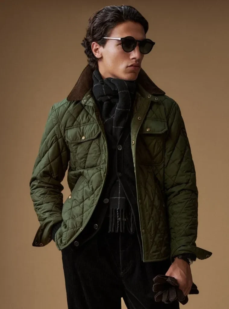 22 Fall Jackets Outfit Ideas for Men to Layer Up in Style 14 a man posing in a Quilted Olive Field Jacket with a Tucked Scarf