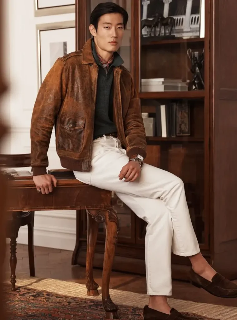 22 Fall Jackets Outfit Ideas for Men to Layer Up in Style 15 a man wearing a Distressed Leather Bomber with Crisp White Denim