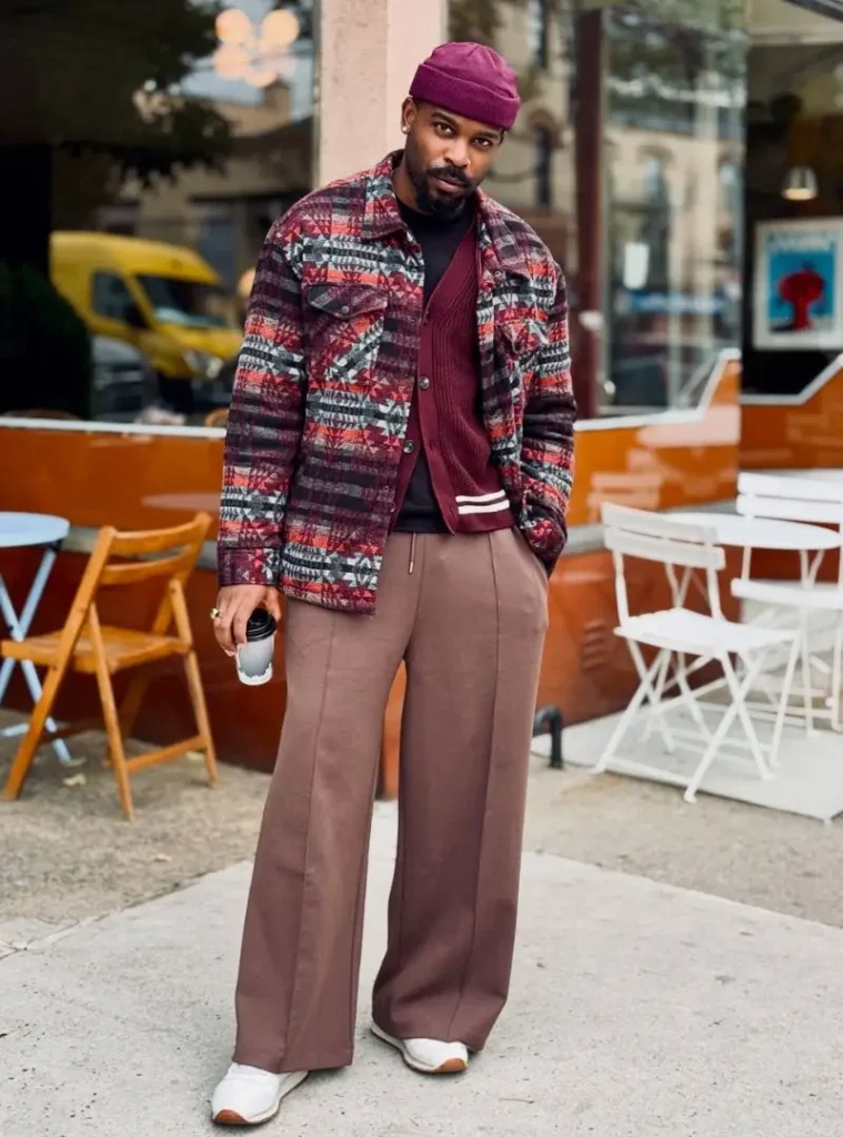 17 Easy Men Fall Outfit Ideas That Keep You Warm 8 a man posing in a Southwestern Tapestry Shacket over Burgundy Knitwear