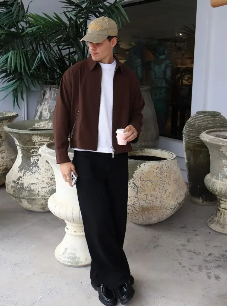 17 Easy Men Fall Outfit Ideas That Keep You Warm 7 a man wearing a Cropped Chocolate Harrington Jacket with Wide Black Slacks