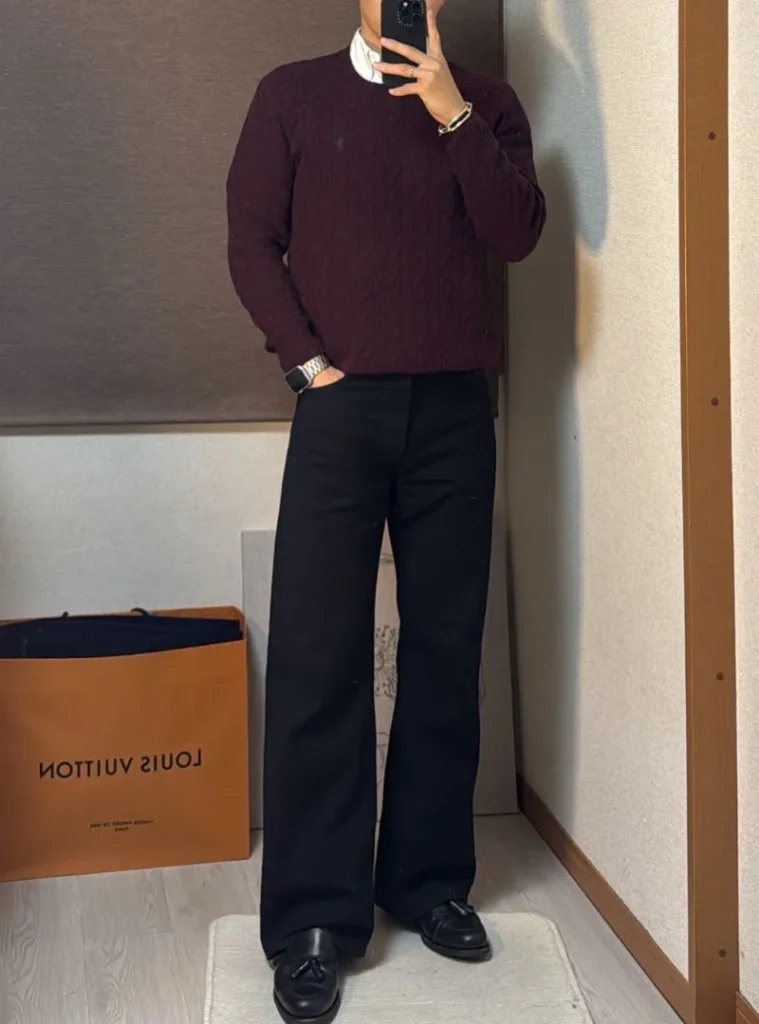 12 Smart Fall Business Casual Outfit Ideas to Look Sharp 11 a man wearing a Burgundy Cable-Knit Crewneck with Wide Black Trousers