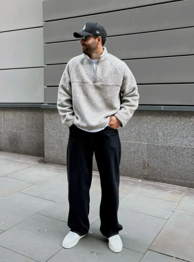 20 Easy Ideas for Fall Casual Outfits Men Can Rely On 8 a man posing in a Quarter-Zip Sherpa Fleece with Relaxed Black Denim