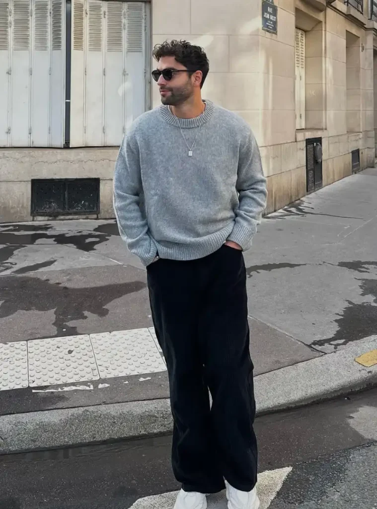 20 Easy Ideas for Fall Casual Outfits Men Can Rely On 7 a man wearing a Brushed Grey Crewneck with Loose Black Corduroy