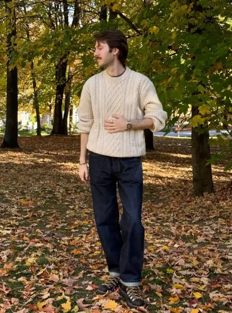 20 Easy Ideas for Fall Casual Outfits Men Can Rely On 3 a man wearing Cream Cable Knit with Dark Denim and Hiking Boots
