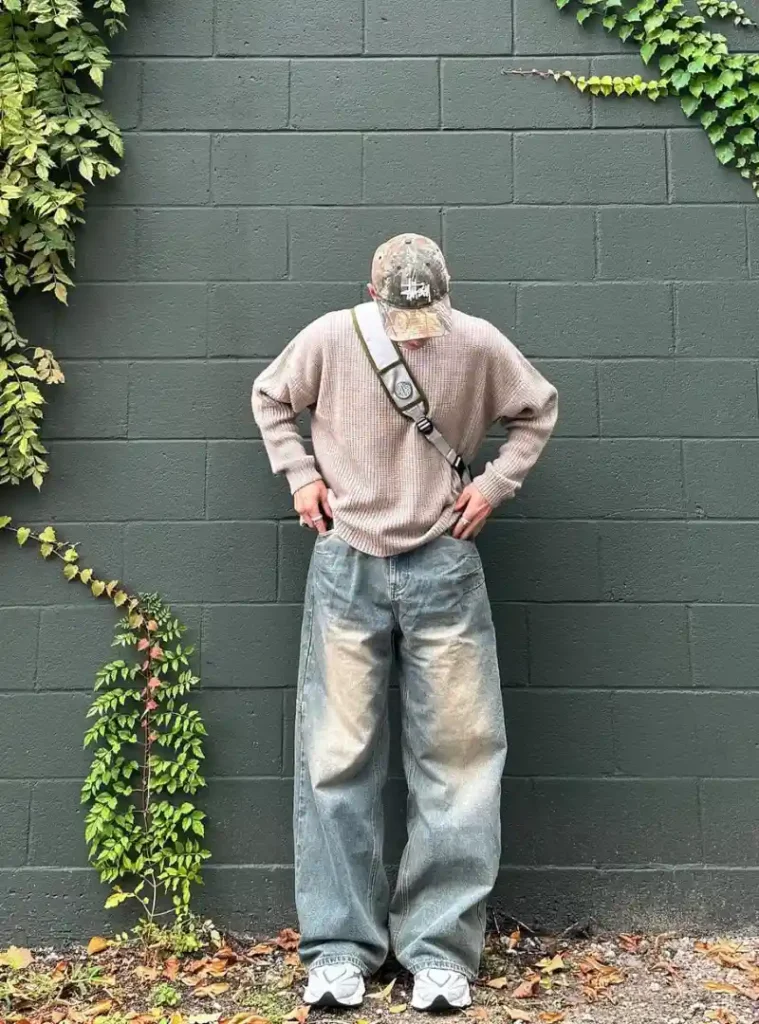 20 Easy Ideas for Fall Casual Outfits Men Can Rely On 2 A man posing in Waffle Knit Sweater with Ultra Wide Vintage Denim
